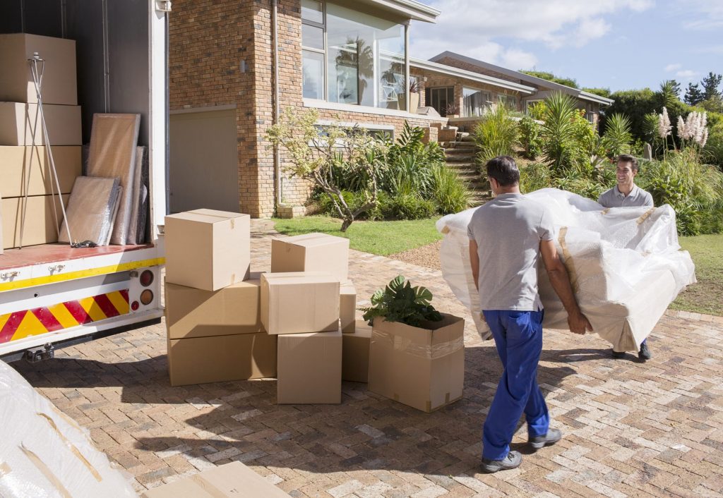 Reliable Panama City Beach FL movers - Loading moving truck with furniture
